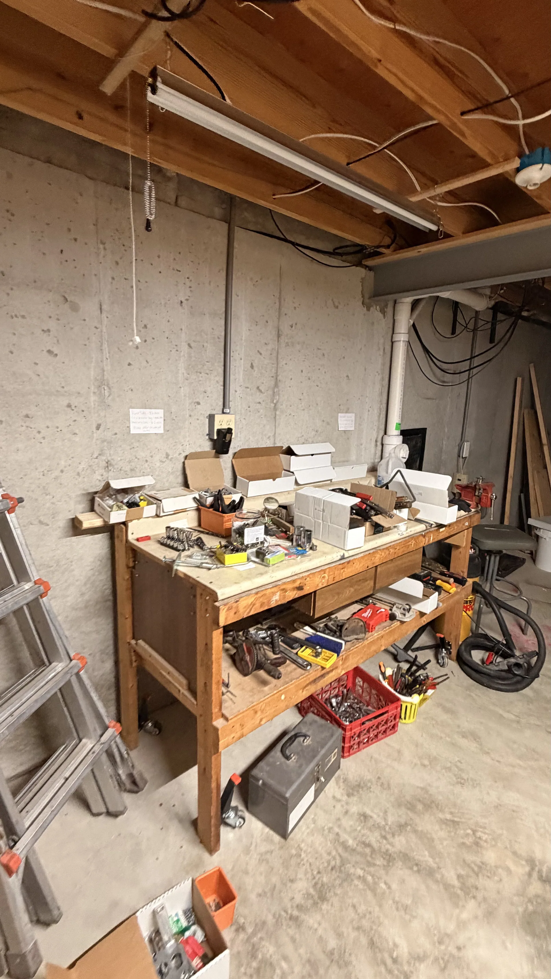 Gallery/basement wooden workbench hand tools vise at an estate sale St. Peters