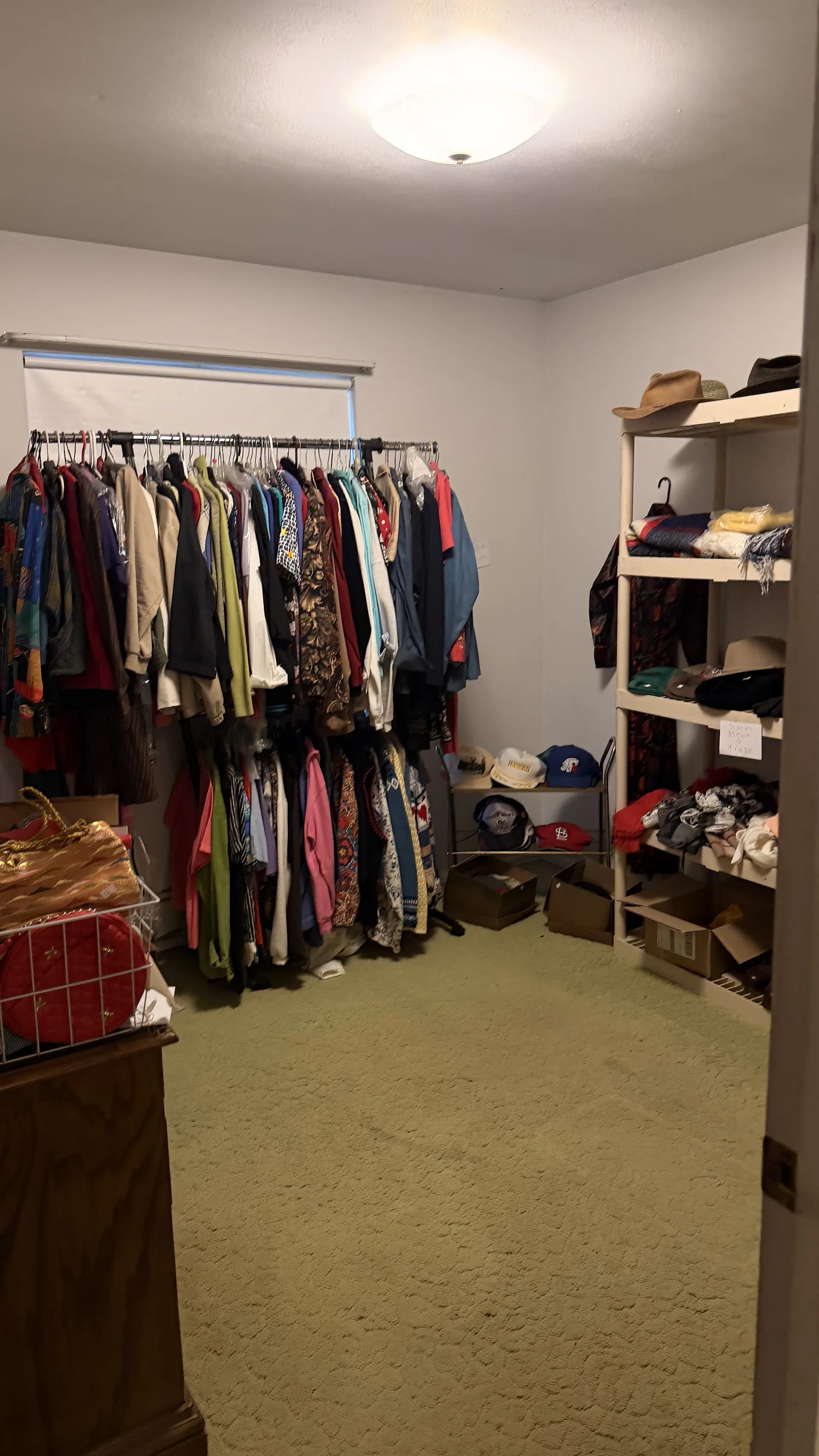 Gallery/bedroom double clothing rack hats shelving at an estate sale ofall
