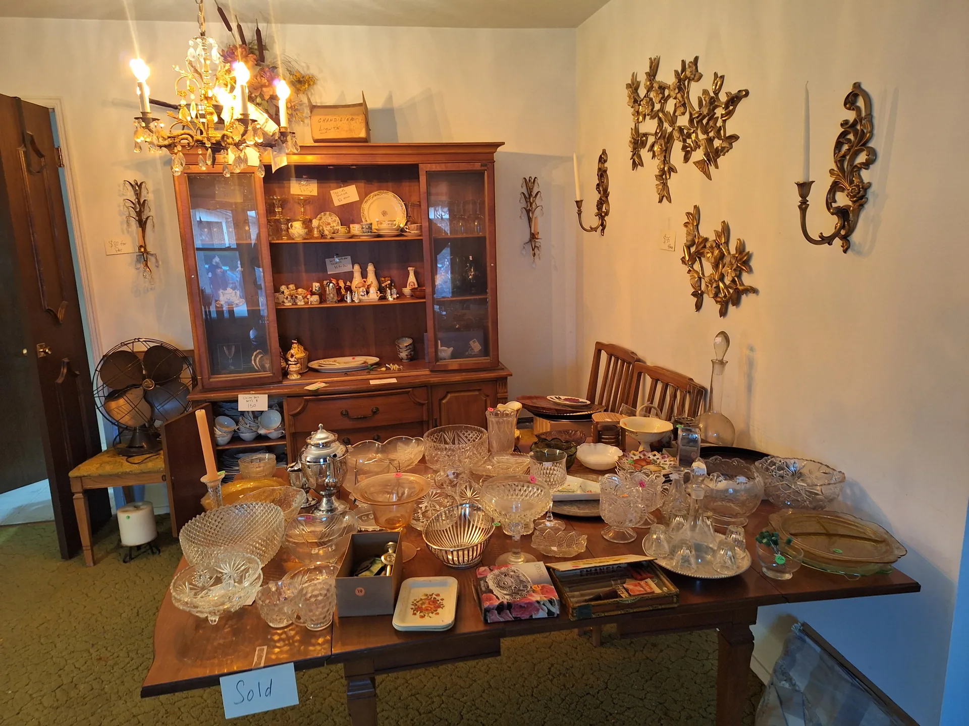 Dining room crystal glassware china cabinet at an estate sale St. Charles