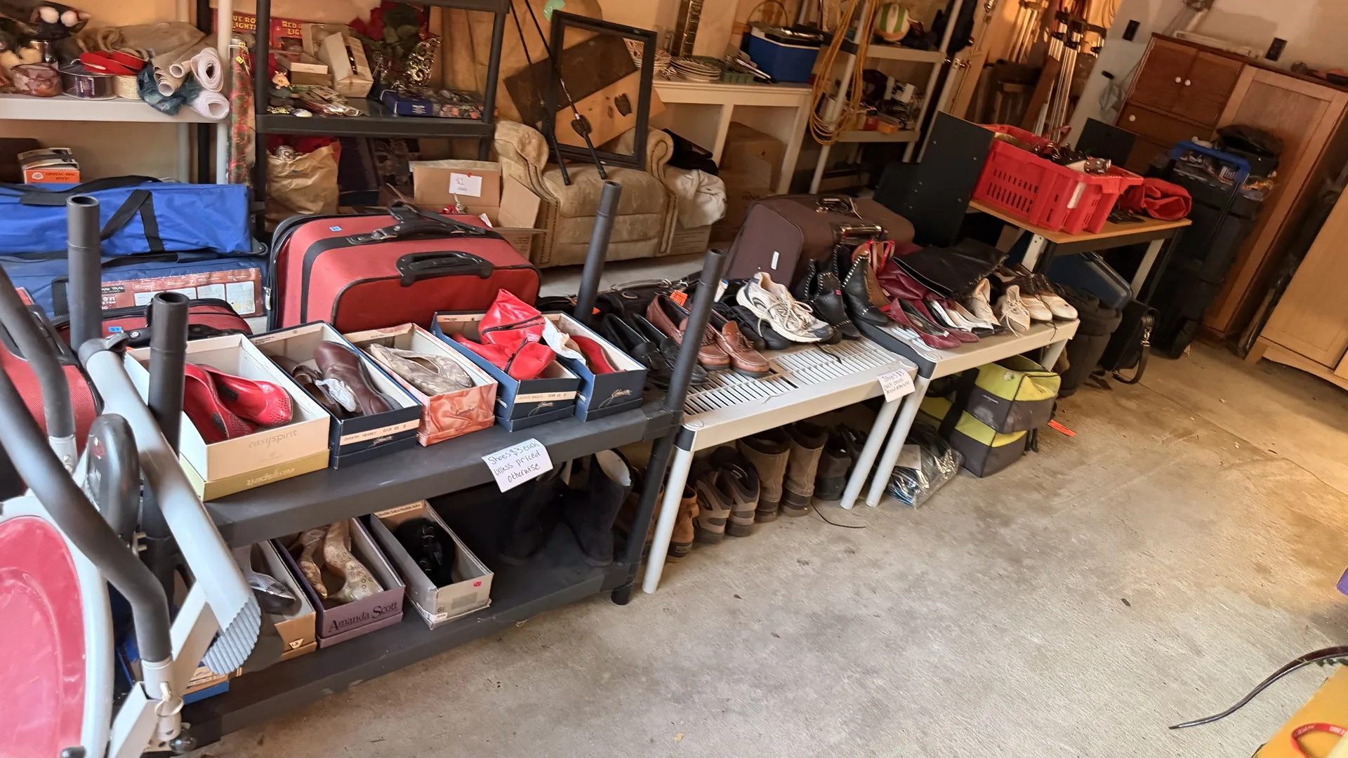 Gallery/garage shoe tables luggage boots at an estate sale Wentzville