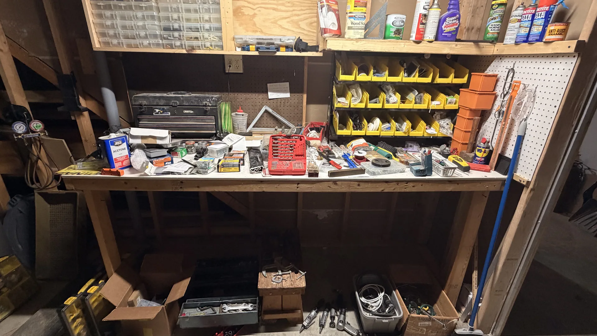 Gallery/garage workbench hand tools yellow parts bins at an estate sale of