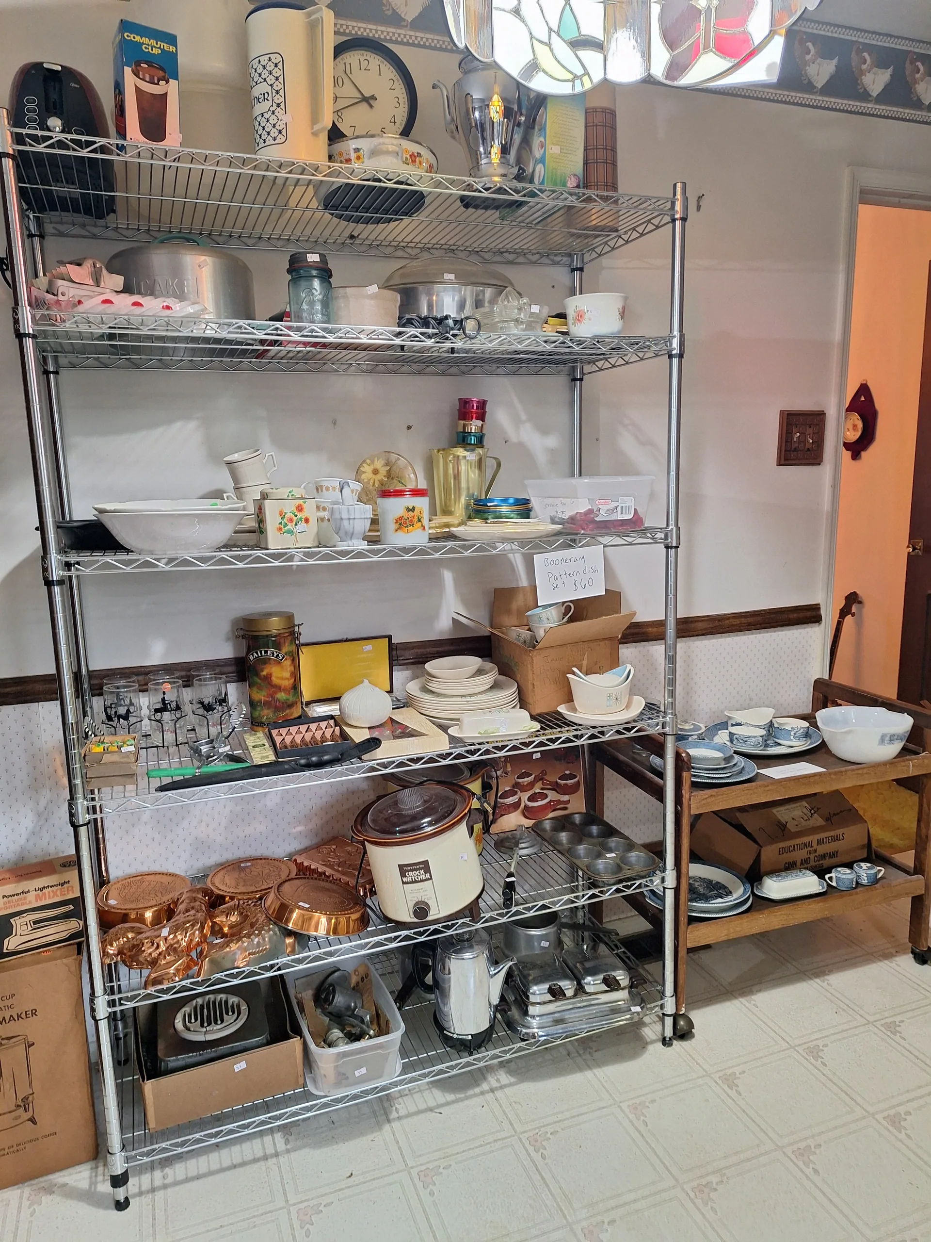 Gallery/kitchen wire shelving copper molds crock pot at an estate sale wen